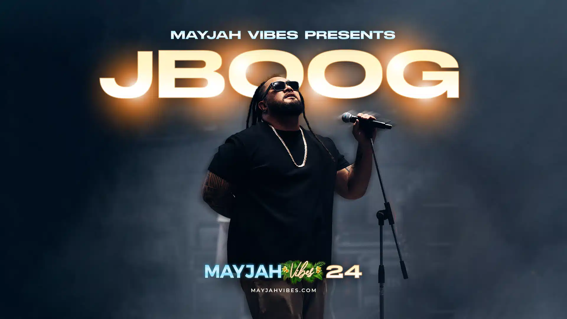 J Boog performing on stage at Mayjah Vibes 2024, headlining the festival with his soulful Polynesian-inspired reggae music.